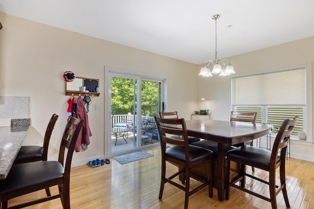 6 Comanche Ter Unit 6, Westford, MA 01886 - dining space with light wood-style floors and a chandelier