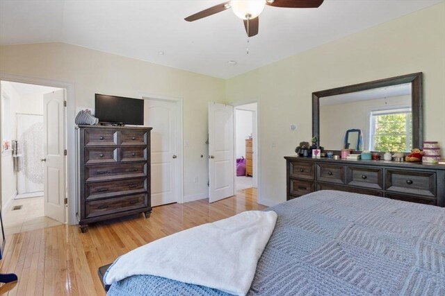 6 Comanche Ter Unit 6, Westford, MA 01886 - bedroom with wood finished floors, vaulted ceiling, ceiling fan, and connected bathroom