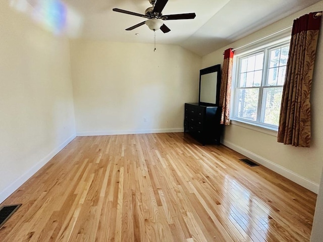 6 Comanche Ter Unit 6, Westford, MA 01886 - unfurnished living room featuring wood finished floors, lofted ceiling, and a ceiling fan