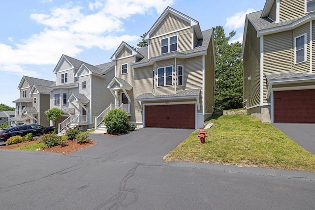 6 Comanche Ter Unit 6, Westford, MA 01886 - view of front of property with a garage, a residential view, driveway, and a front yard