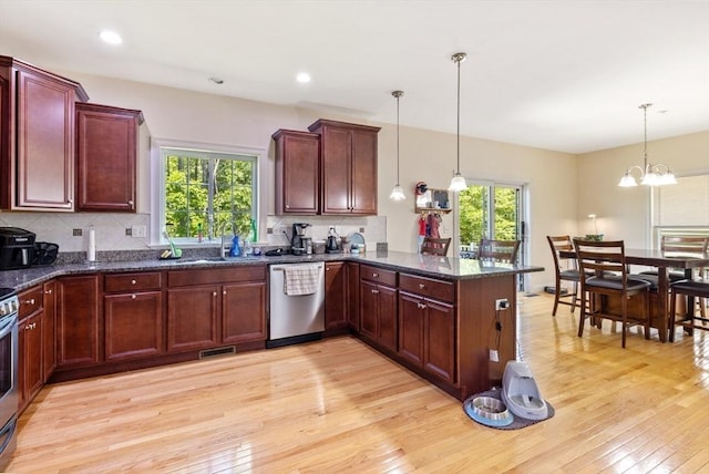 6 Comanche Ter Unit 6, Westford, MA 01886 - kitchen featuring appliances with stainless steel finishes, plenty of natural light, light wood-type flooring, tasteful backsplash, and recessed lighting