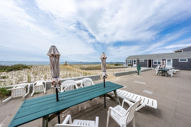 view of patio / terrace featuring a water view