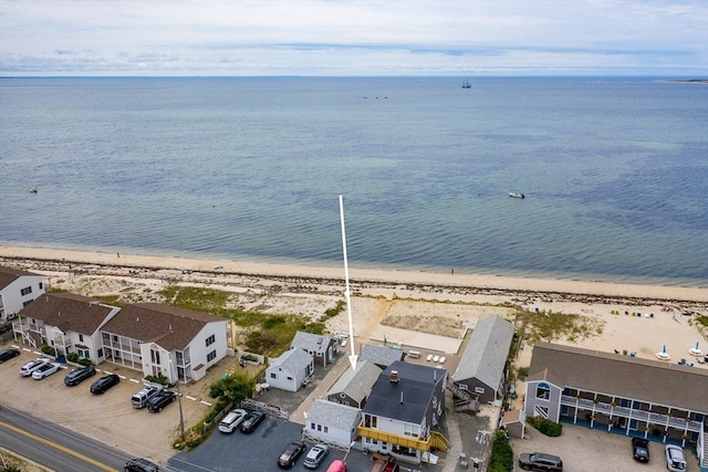 drone / aerial view with a water view and a view of the beach