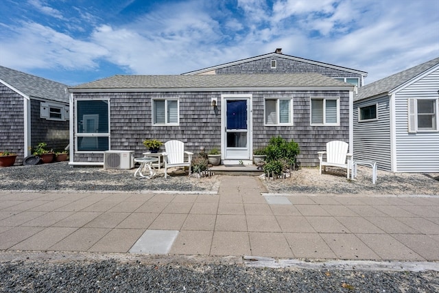 view of front of house featuring a patio and central AC