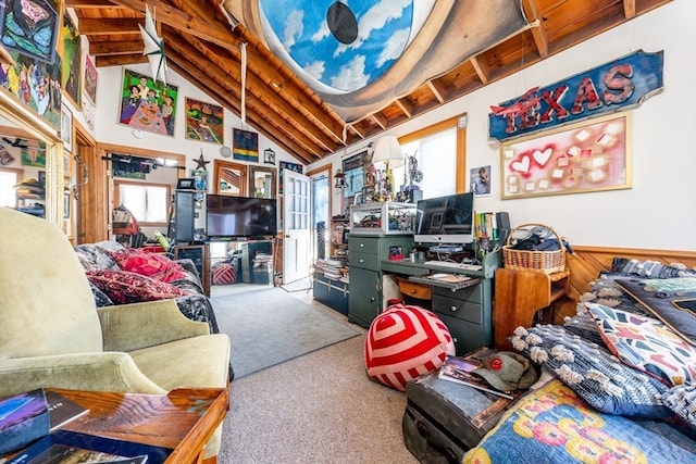 carpeted living room with wood walls and lofted ceiling with beams