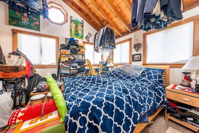 carpeted bedroom featuring multiple windows, lofted ceiling with beams, and wood ceiling