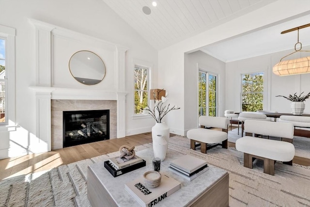 6 Willow Cir, Mashpee, MA 02649 - living room with wood finished floors, a tile fireplace, beam ceiling, and high vaulted ceiling