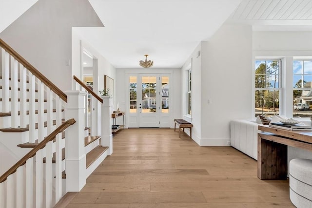 6 Willow Cir, Mashpee, MA 02649 - entryway featuring light wood-style flooring, stairs, and baseboards
