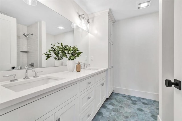 6 Willow Cir, Mashpee, MA 02649 - bathroom with double vanity, tiled shower, and baseboards