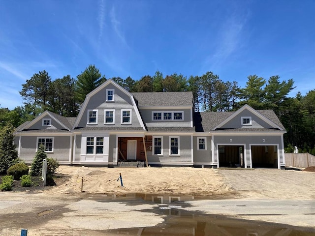 6 Willow Cir, Mashpee, MA 02649 - view of front of house with a garage, roof with shingles, a gambrel roof, and driveway