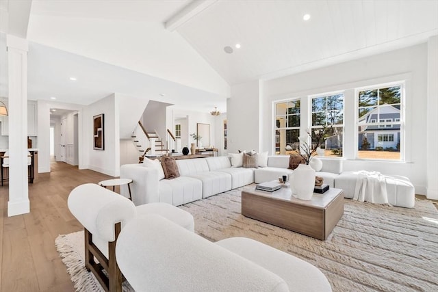 6 Willow Cir, Mashpee, MA 02649 - living room with stairway, light wood-style floors, beam ceiling, recessed lighting, and baseboards