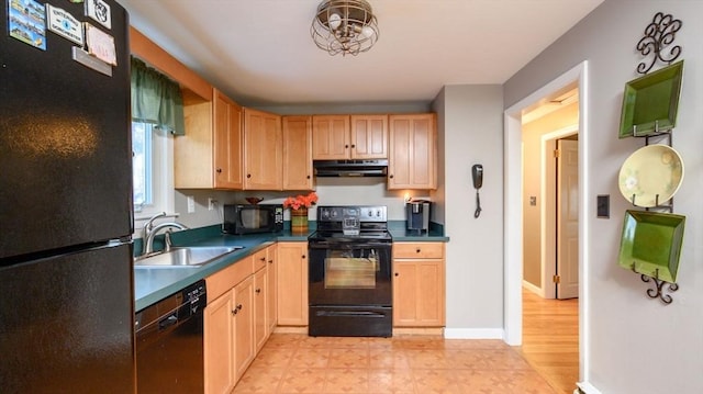 kitchen featuring light brown cabinetry, sink, and black appliances