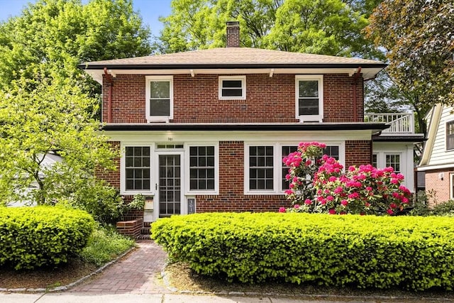 301 Pond St, Boston, MA 02130 - view of front of home with brick siding and a chimney