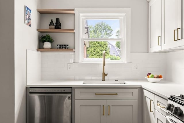 301 Pond St, Boston, MA 02130 - kitchen featuring stainless steel appliances, a sink, tasteful backsplash, open shelves, and light countertops