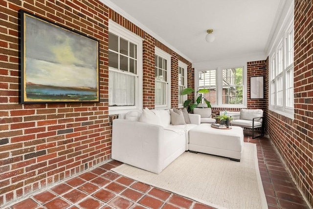 301 Pond St, Boston, MA 02130 - sunroom featuring brick wall, ornamental molding, tile patterned flooring, and outdoor lounge area