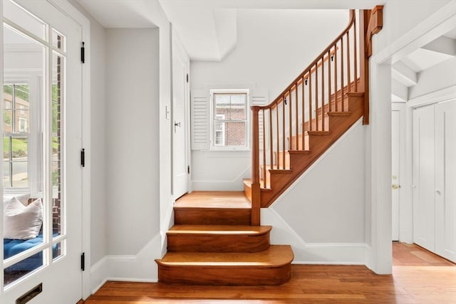 301 Pond St, Boston, MA 02130 - staircase with wood finished floors and baseboards