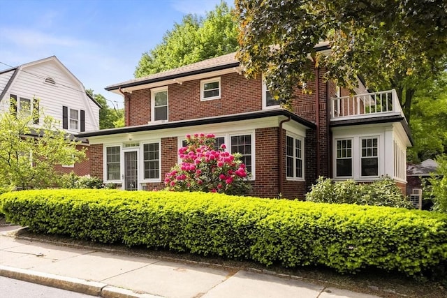301 Pond St, Boston, MA 02130 - view of front of property featuring brick siding and a balcony