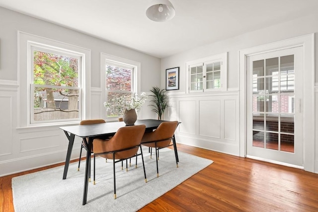 301 Pond St, Boston, MA 02130 - dining space with a decorative wall, wood finished floors, and a wainscoted wall