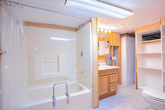 bathroom with vanity, tile patterned floors, toilet, and shower / washtub combination