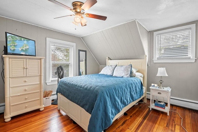 bedroom with lofted ceiling, ceiling fan, and wood-type flooring