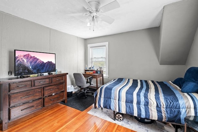 bedroom with ceiling fan and light wood-type flooring