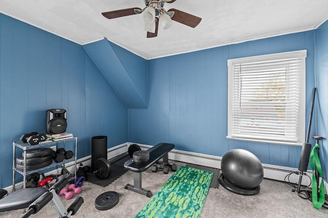 exercise room featuring ceiling fan, carpet floors, and a baseboard heating unit