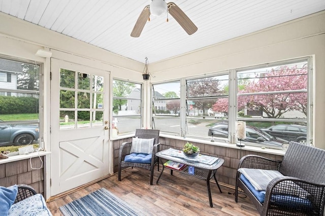 sunroom with a wealth of natural light and a ceiling fan