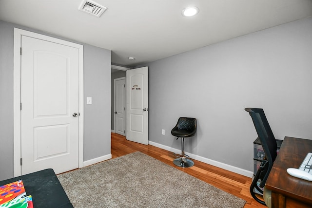 office space with light hardwood / wood-style flooring