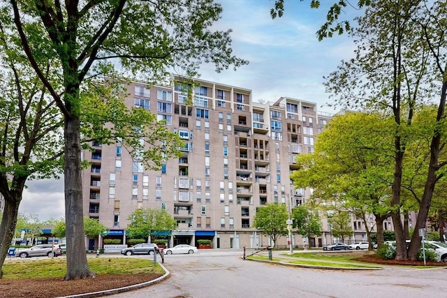 33 Pond Ave Unit Ph1207, Brookline, MA 02445 - view of apartment building / complex featuring uncovered parking