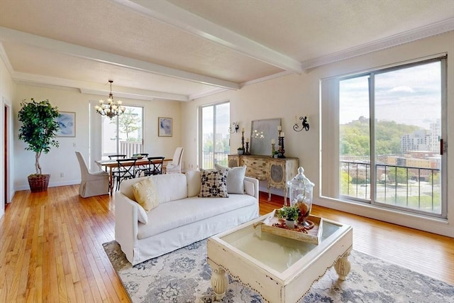 33 Pond Ave Unit Ph1207, Brookline, MA 02445 - living room featuring light wood-style flooring, a chandelier, beam ceiling, and baseboards