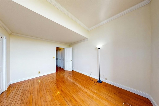 33 Pond Ave Unit Ph1207, Brookline, MA 02445 - spare room with crown molding, light wood-style floors, and baseboards