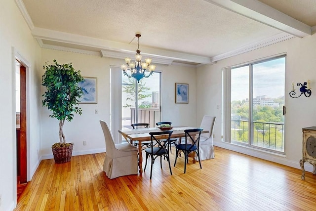 33 Pond Ave Unit Ph1207, Brookline, MA 02445 - dining space with beamed ceiling, a chandelier, light wood-style flooring, healthy amount of natural light, and baseboards