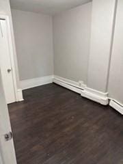 620 Dudley St, Boston, MA 02125 - empty room featuring dark wood finished floors and baseboards