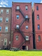 620 Dudley St, Boston, MA 02125 - rear view of property featuring a yard