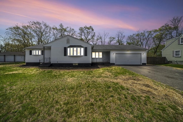 73 Mckinley Ave, Ludlow, MA 01056 - single story home with a garage, a front lawn, entry steps, and aphalt driveway