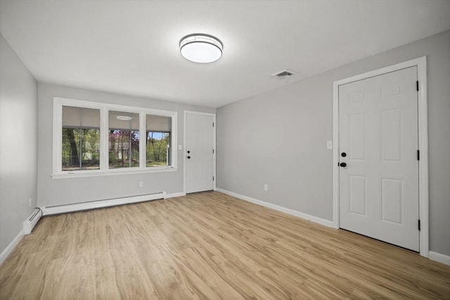 73 Mckinley Ave, Ludlow, MA 01056 - interior space with light wood-style floors, baseboards, a baseboard heating unit, and visible vents