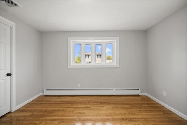 73 Mckinley Ave, Ludlow, MA 01056 - unfurnished room with visible vents, a baseboard radiator, baseboards, and wood finished floors