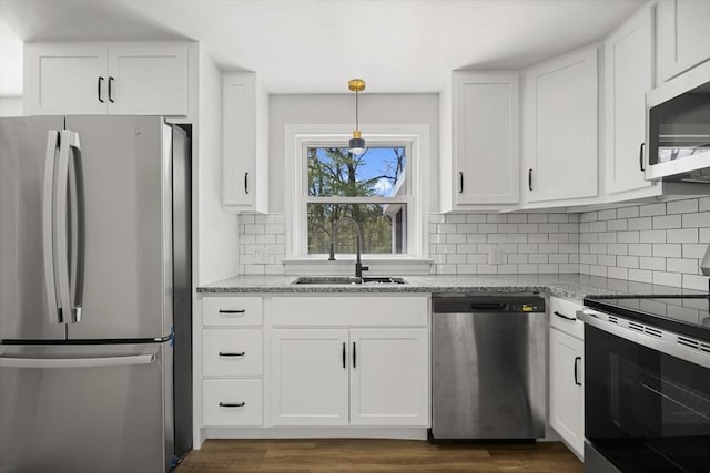 73 Mckinley Ave, Ludlow, MA 01056 - kitchen with a sink, appliances with stainless steel finishes, white cabinets, and light stone countertops