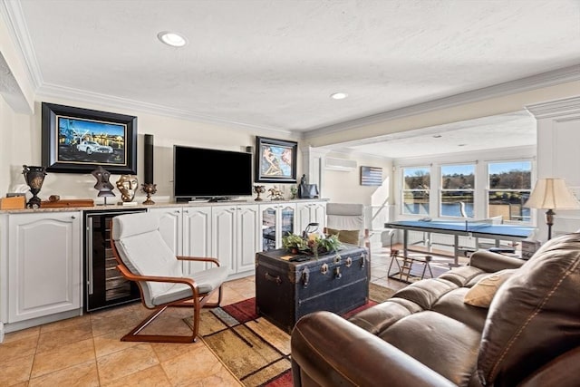 tiled living room with crown molding, indoor bar, and beverage cooler