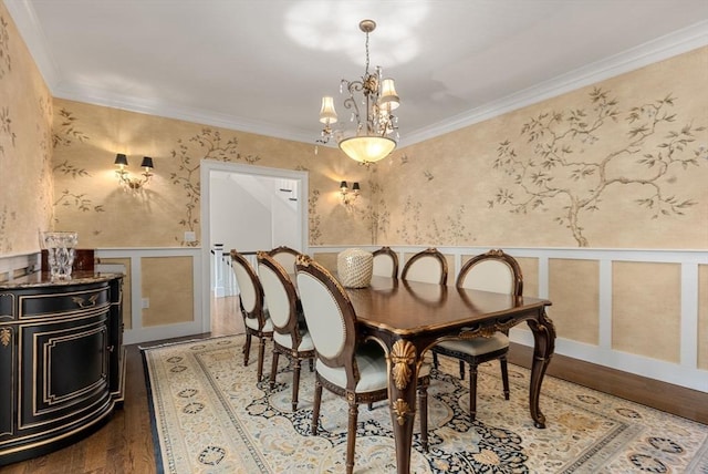 dining area featuring ornamental molding and hardwood / wood-style floors