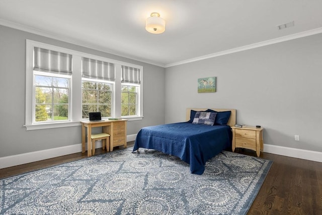 bedroom featuring crown molding and dark hardwood / wood-style floors