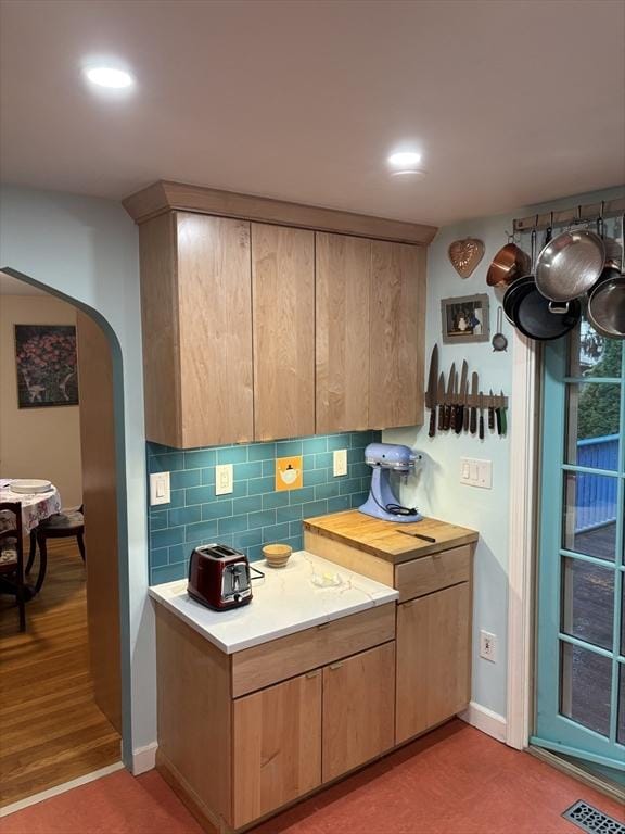 14 Anderson Ave, Holyoke, MA 01040 - kitchen with arched walkways, light countertops, tasteful backsplash, baseboards, and recessed lighting
