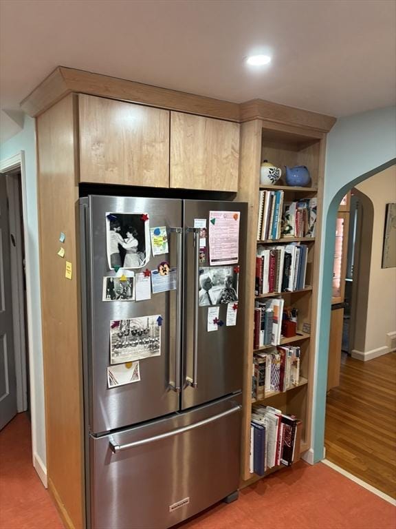 14 Anderson Ave, Holyoke, MA 01040 - detailed view of freestanding refrigerator, arched walkways, baseboards, recessed lighting, and light wood-style flooring