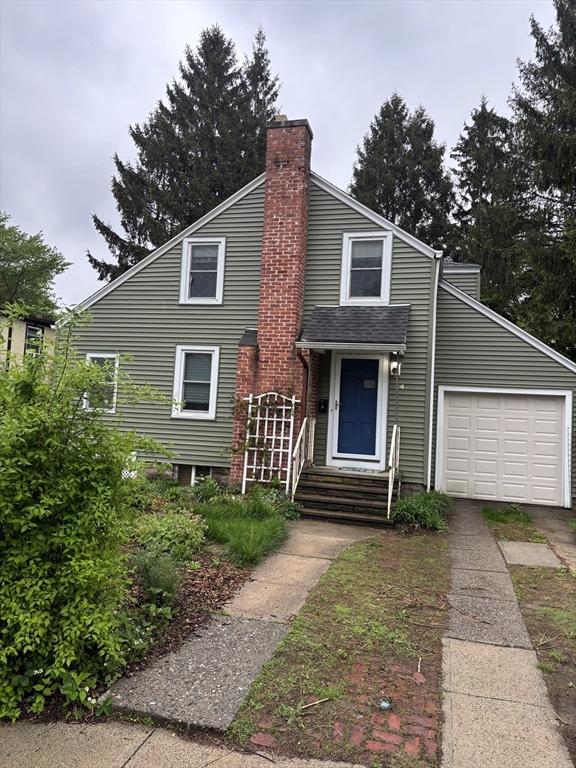 14 Anderson Ave, Holyoke, MA 01040 - view of front of home featuring a chimney and an attached garage