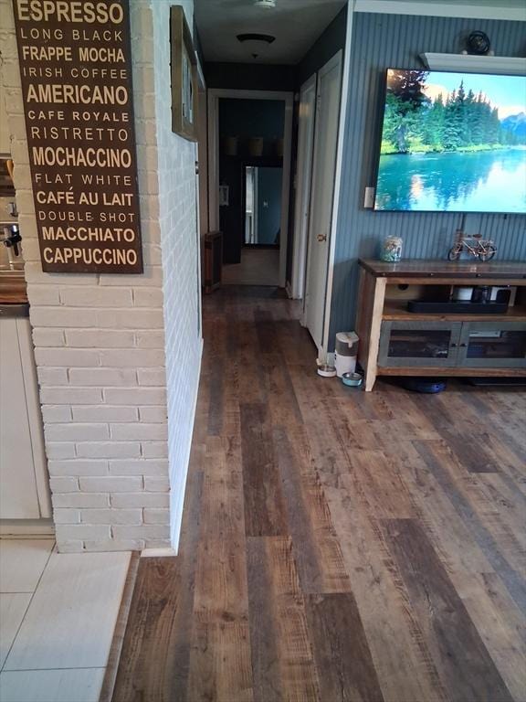 hall with wood finished floors