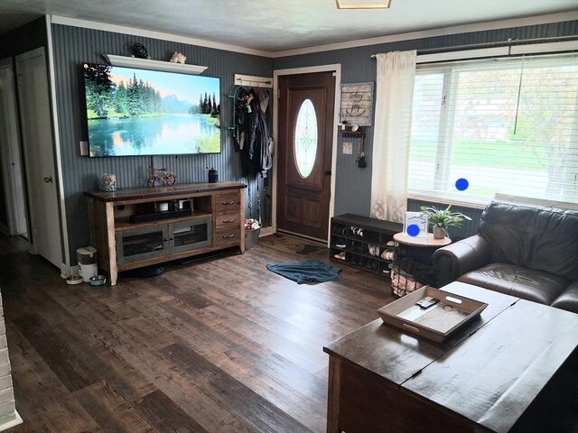living room featuring wood finished floors and ornamental molding