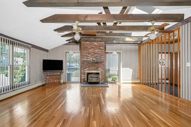 18 Patriot Rd, Tewksbury, MA 01876 - unfurnished living room with ceiling fan, wood finished floors, a brick fireplace, and a baseboard radiator