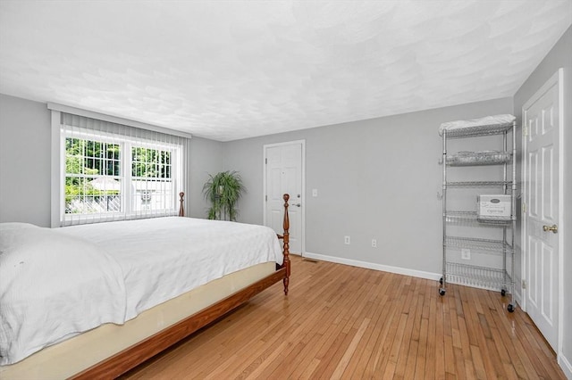 18 Patriot Rd, Tewksbury, MA 01876 - bedroom with light wood-style flooring and baseboards