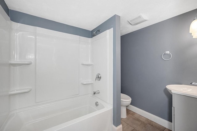 18 Patriot Rd, Tewksbury, MA 01876 - bathroom with vanity, toilet, baseboards, and  shower combination