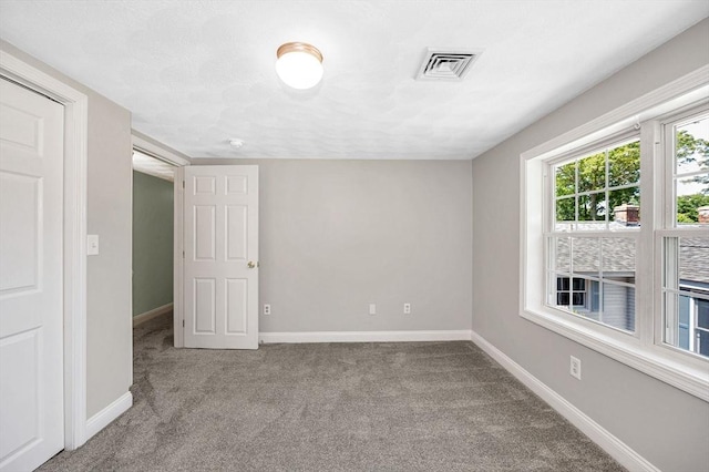 18 Patriot Rd, Tewksbury, MA 01876 - carpeted empty room featuring baseboards